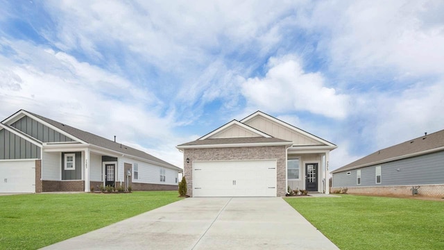 view of front of home featuring concrete driveway, a garage, board and batten siding, and a front yard