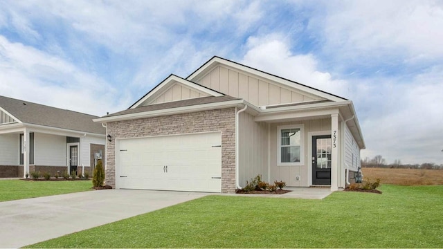 view of front of home with concrete driveway, a front lawn, stone siding, board and batten siding, and a garage