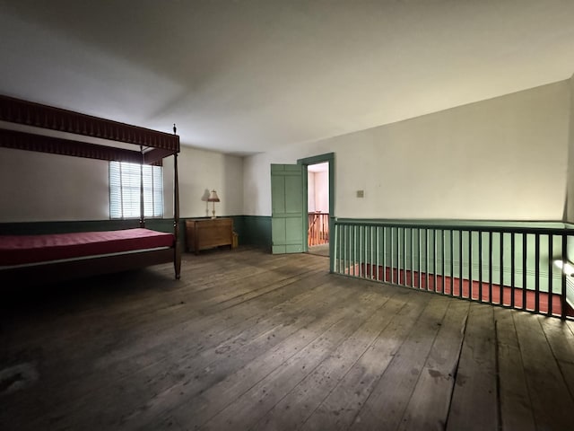 bedroom with wood-type flooring