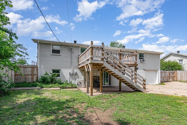 196 Haven Dr, Clarksville, TN 37042 - rear view of house featuring brick siding, driveway, a wooden deck, and ac unit