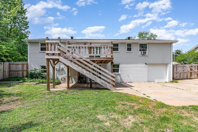 196 Haven Dr, Clarksville, TN 37042 - rear view of house featuring a wooden deck, brick siding, stairway, concrete driveway, and a garage