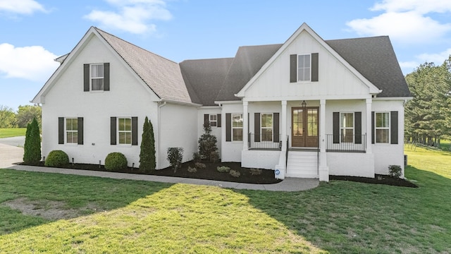 2040 Cairo Bend Rd, Lebanon, TN 37087 - view of front of property featuring board and batten siding, brick siding, roof with shingles, french doors, and a front yard