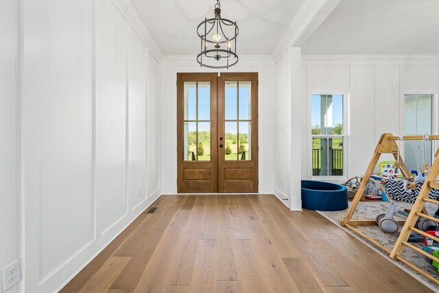 2040 Cairo Bend Rd, Lebanon, TN 37087 - foyer entrance featuring crown molding, french doors, a decorative wall, and wood-type flooring