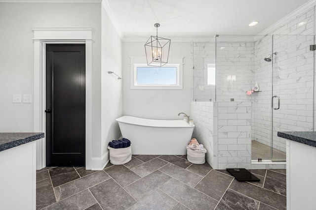 2040 Cairo Bend Rd, Lebanon, TN 37087 - bathroom with a soaking tub, a stall shower, an inviting chandelier, ornamental molding, and vanity