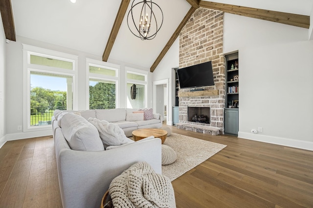 2040 Cairo Bend Rd, Lebanon, TN 37087 - living room featuring a chandelier, a large fireplace, baseboards, beam ceiling, and wood finished floors