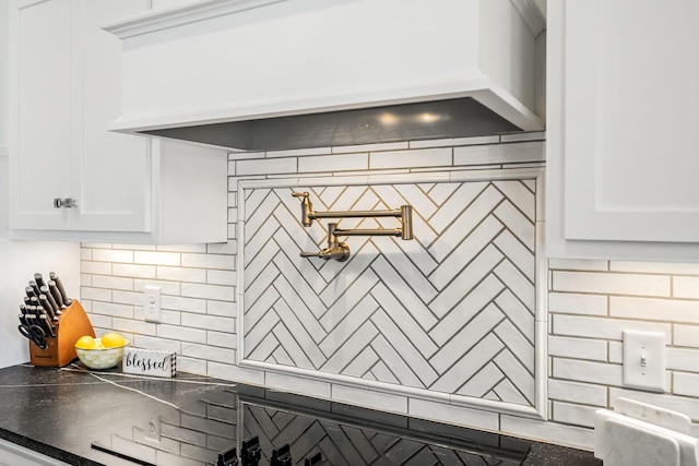 2040 Cairo Bend Rd, Lebanon, TN 37087 - interior details with dark countertops, custom range hood, white cabinetry, and decorative backsplash