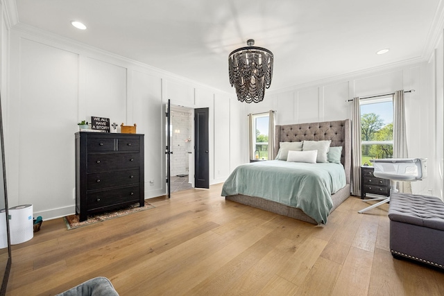 2040 Cairo Bend Rd, Lebanon, TN 37087 - bedroom with recessed lighting, a notable chandelier, light wood-type flooring, a decorative wall, and ornamental molding