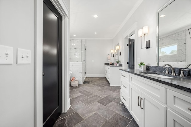 2040 Cairo Bend Rd, Lebanon, TN 37087 - bathroom with recessed lighting, two vanities, a sink, a stall shower, and crown molding