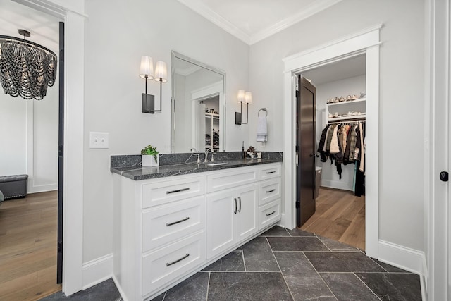 2040 Cairo Bend Rd, Lebanon, TN 37087 - full bath with vanity, a spacious closet, ornamental molding, and baseboards