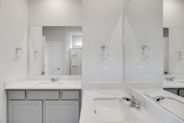 full bath with two vanities and a sink