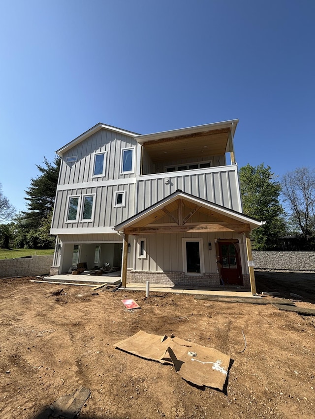 533 Whispering Hills Dr Unit B, Nashville, TN 37211 - rear view of house with brick siding, a balcony, a porch, and board and batten siding
