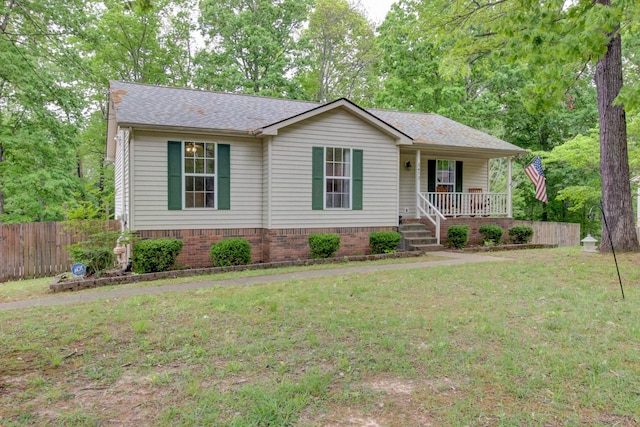 3473 Hunters Rdg, Woodlawn, TN 37191 - ranch-style house featuring a porch, fence, a shingled roof, and a front lawn