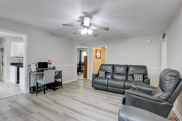 3473 Hunters Rdg, Woodlawn, TN 37191 - living room featuring light wood-style floors, baseboards, and a ceiling fan