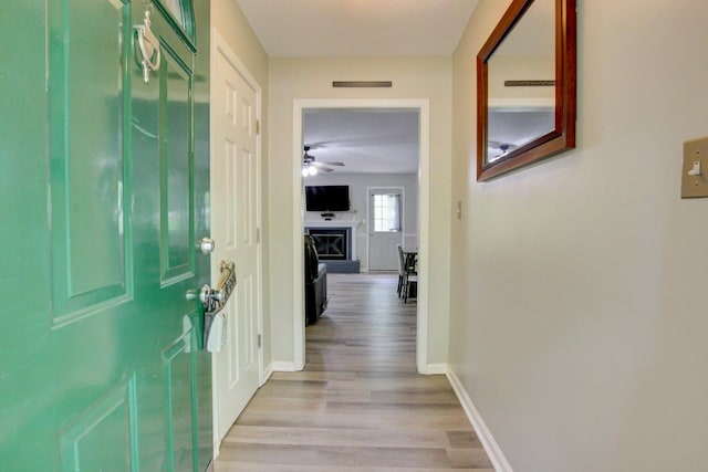 3473 Hunters Rdg, Woodlawn, TN 37191 - hall with baseboards, visible vents, and light wood-style floors