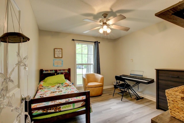 3473 Hunters Rdg, Woodlawn, TN 37191 - bedroom with baseboards, a ceiling fan, and light wood-style flooring