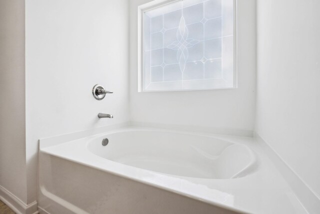 full bathroom with a garden tub