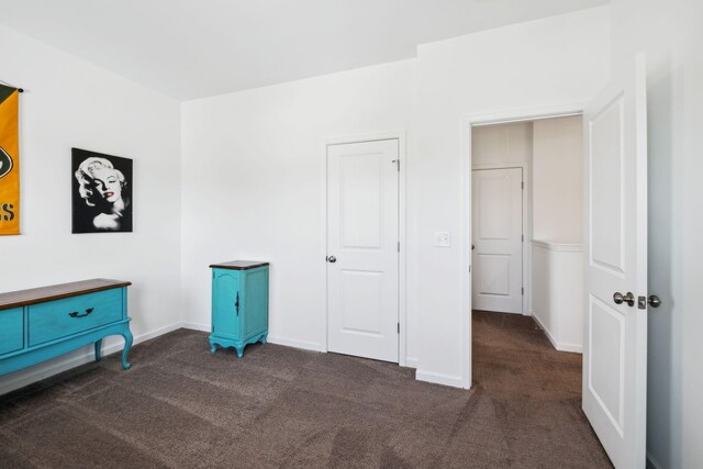 unfurnished bedroom with carpet and baseboards