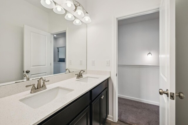 bathroom featuring double vanity and a sink