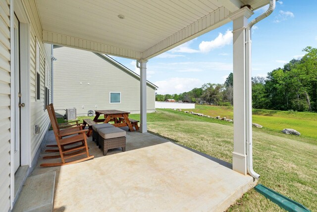 view of patio / terrace featuring outdoor dining space and central AC
