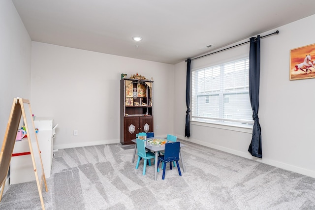 recreation room with baseboards, visible vents, and carpet