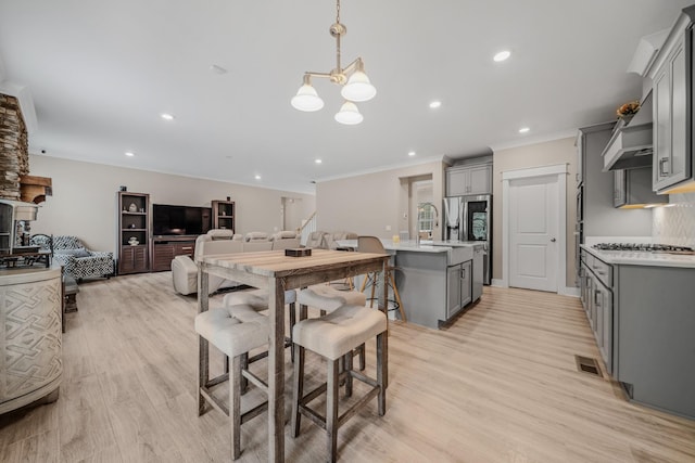 3032 Oxford Dr, Mount Juliet, TN 37122 - dining area featuring a chandelier, light wood finished floors, crown molding, and recessed lighting