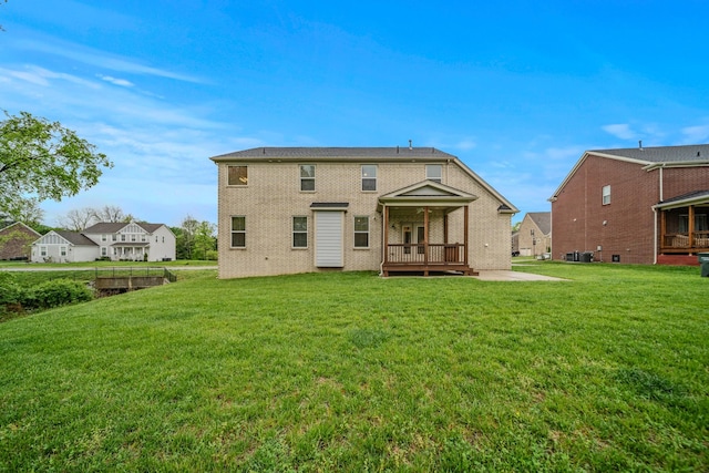 3032 Oxford Dr, Mount Juliet, TN 37122 - rear view of property featuring a lawn and brick siding