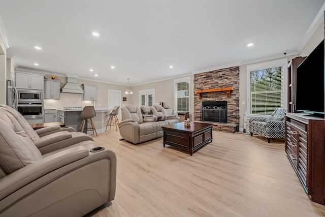 3032 Oxford Dr, Mount Juliet, TN 37122 - living area with recessed lighting, crown molding, light wood-style floors, and a fireplace