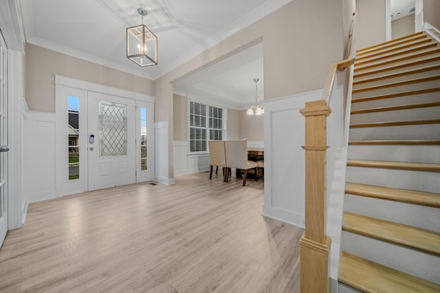 3032 Oxford Dr, Mount Juliet, TN 37122 - entrance foyer featuring an inviting chandelier, a decorative wall, stairs, and light wood finished floors