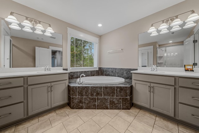 3032 Oxford Dr, Mount Juliet, TN 37122 - full bath with a garden tub, two vanities, tile patterned floors, and a sink