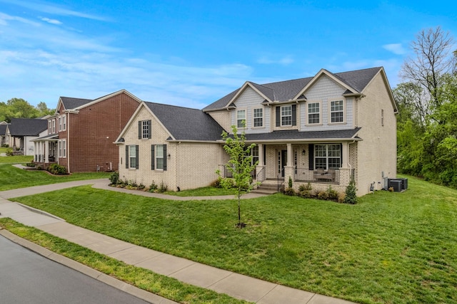 3032 Oxford Dr, Mount Juliet, TN 37122 - traditional-style home with a porch, brick siding, a front yard, and roof with shingles