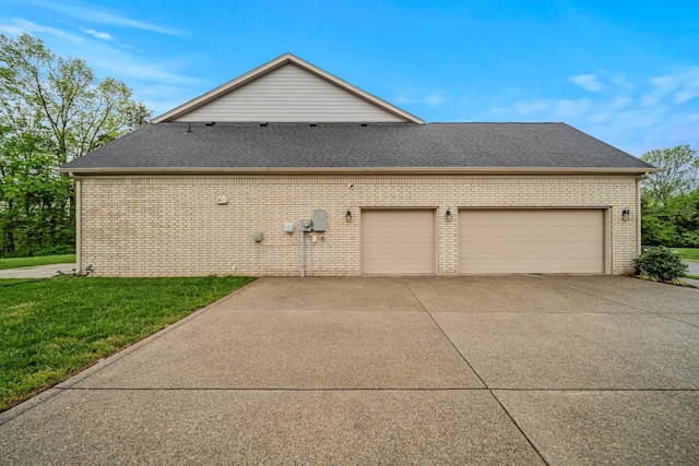 3032 Oxford Dr, Mount Juliet, TN 37122 - view of side of home with a shingled roof, driveway, and brick siding