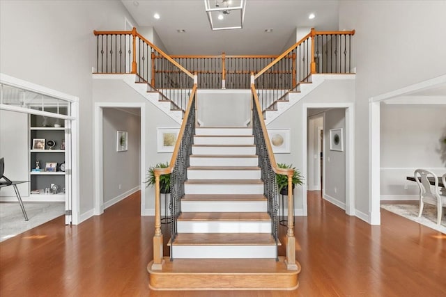 9502 Peebles Ct, Brentwood, TN 37027 - stairway featuring a high ceiling, wood finished floors, and recessed lighting