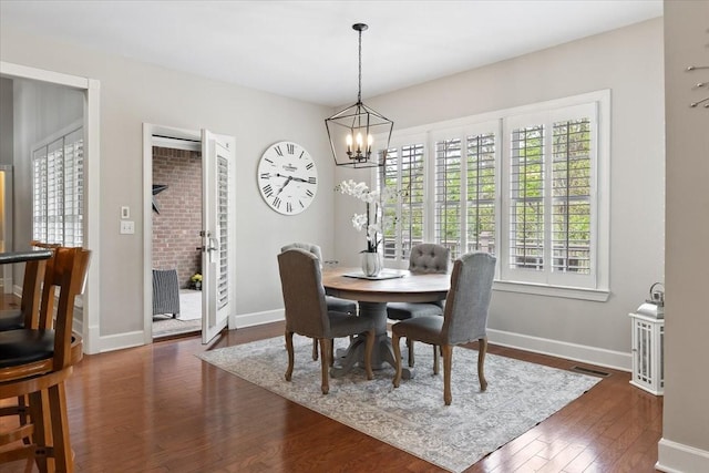 9502 Peebles Ct, Brentwood, TN 37027 - dining space featuring baseboards, a notable chandelier, dark wood-type flooring, and visible vents
