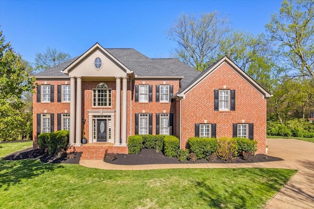 9502 Peebles Ct, Brentwood, TN 37027 - greek revival inspired property with a front lawn and brick siding