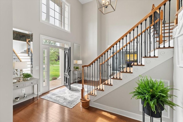 9502 Peebles Ct, Brentwood, TN 37027 - entrance foyer with stairway, a towering ceiling, and hardwood / wood-style flooring