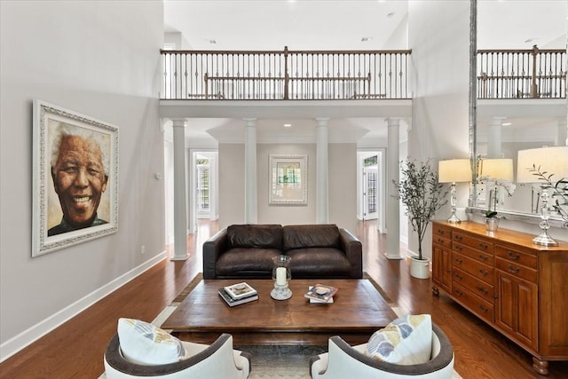9502 Peebles Ct, Brentwood, TN 37027 - living room featuring plenty of natural light, a towering ceiling, and ornate columns