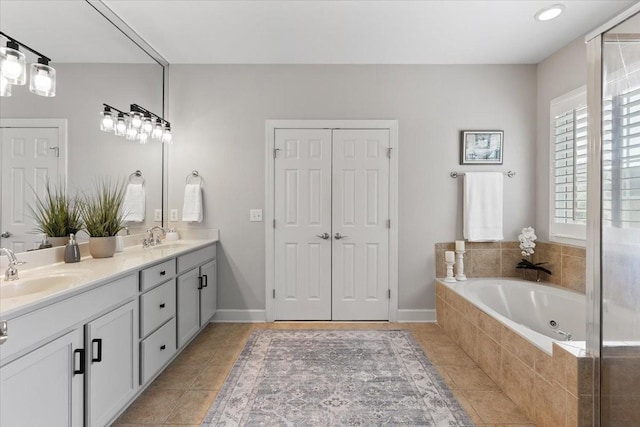 9502 Peebles Ct, Brentwood, TN 37027 - bathroom featuring tile patterned flooring, a sink, a whirlpool tub, and double vanity