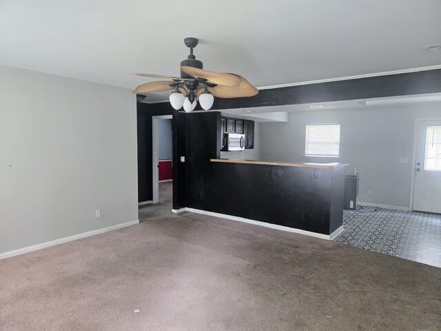 300 Hardin Ave, Dickson, TN 37055 - spare room with light colored carpet, ceiling fan, baseboards, and healthy amount of natural light