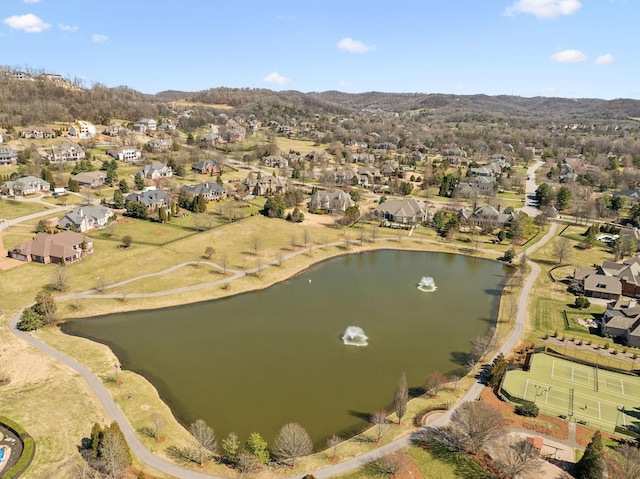 drone / aerial view with a residential view and a water and mountain view