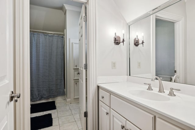 bathroom featuring a shower with shower curtain, vanity, and tile patterned floors