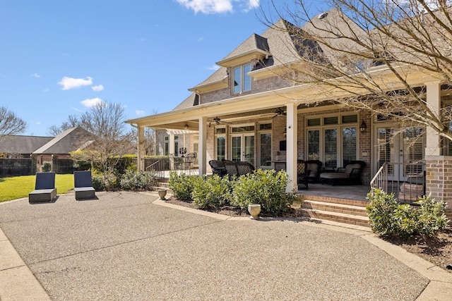 exterior space with a ceiling fan and covered porch