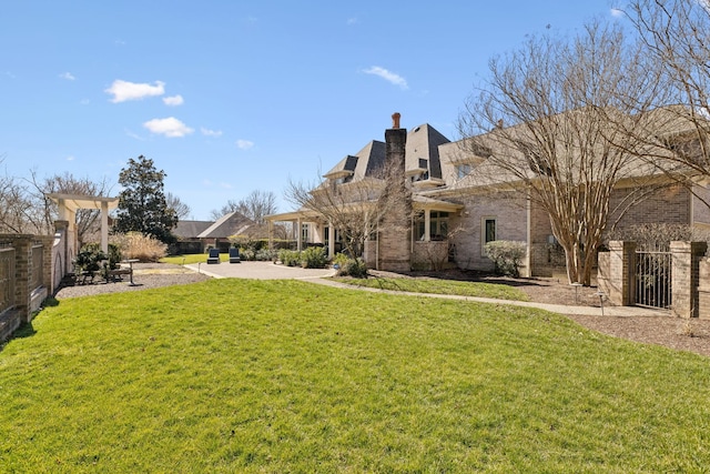 view of yard with fence and a patio area