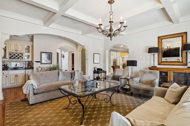 living room with arched walkways, beam ceiling, coffered ceiling, and wet bar