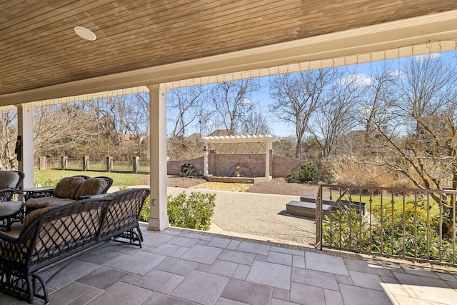 view of patio featuring a pergola and a fenced backyard