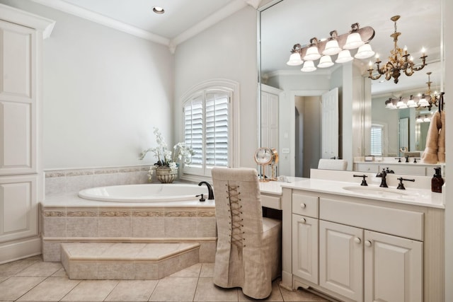 full bath featuring tile patterned floors, an inviting chandelier, vanity, crown molding, and a garden tub