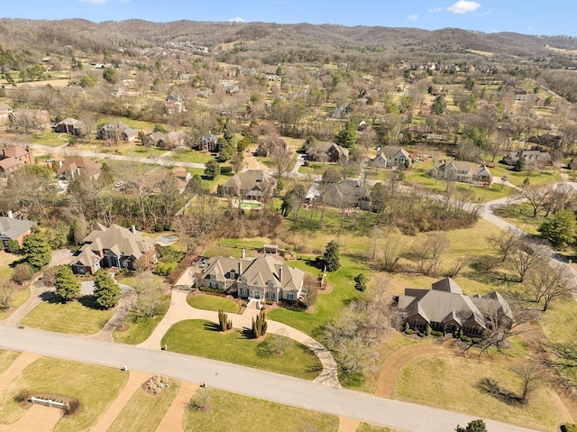 birds eye view of property with a mountain view and a residential view