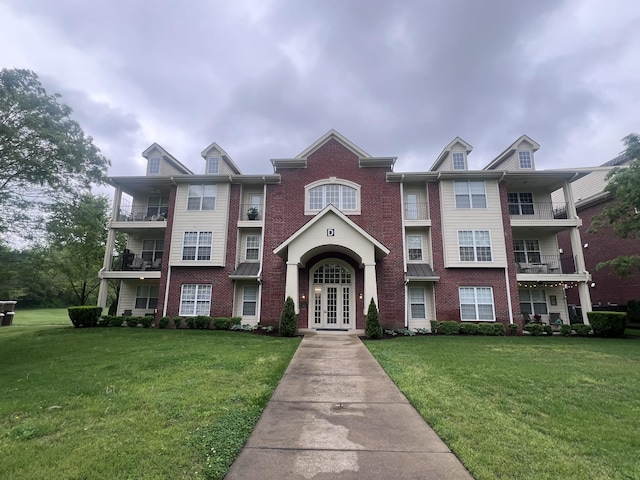 3201 Aspen Grove Dr Unit D3, Franklin, TN 37067 - view of front of home featuring french doors, brick siding, and a front yard