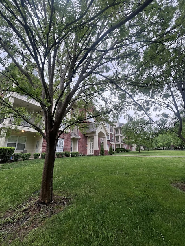 3201 Aspen Grove Dr Unit D3, Franklin, TN 37067 - obstructed view of property with brick siding and a front lawn