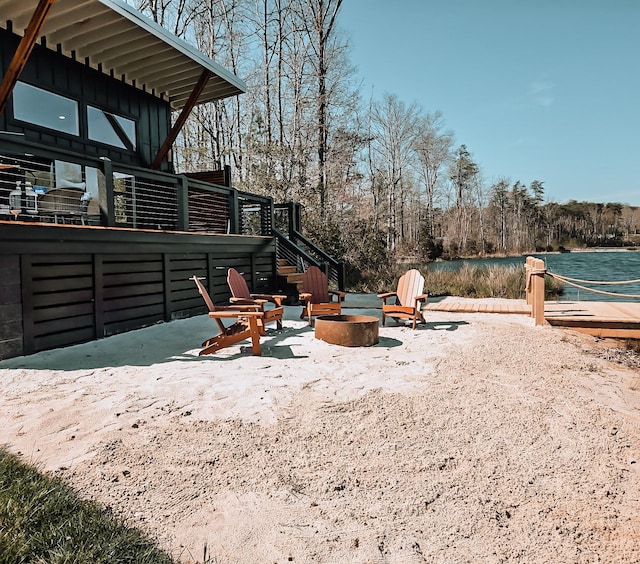 135 Hemlock Cv, Tracy City, TN 37387 - view of yard featuring stairs, a water view, a fire pit, and a patio