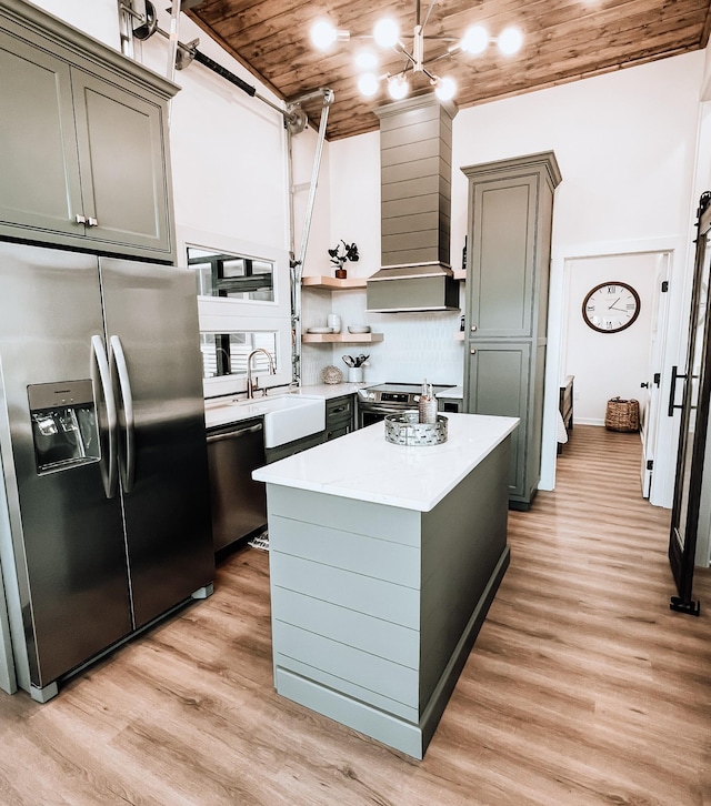 135 Hemlock Cv, Tracy City, TN 37387 - kitchen with light wood-type flooring, a sink, appliances with stainless steel finishes, and light countertops